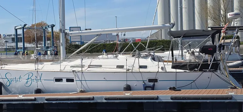 Spirit Bird Yacht Photos Pics 2004 Beneteau Oceanis 423 sailboat docked at marina, side view.