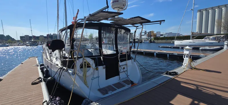 Spirit Bird Yacht Photos Pics 2004 Beneteau Oceanis 423 sailboat docked at marina under clear blue sky.