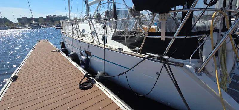 Spirit Bird Yacht Photos Pics 2004 Beneteau Oceanis 423 yacht docked at marina on sunny day.