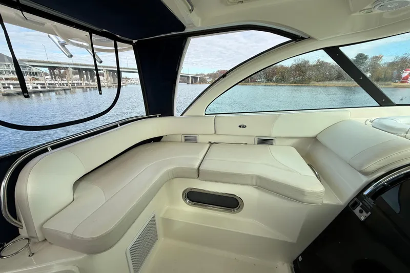  Yacht Photos Pics Interior of 2009 Pursuit OS 375 Offshore boat with white seating and waterfront view.