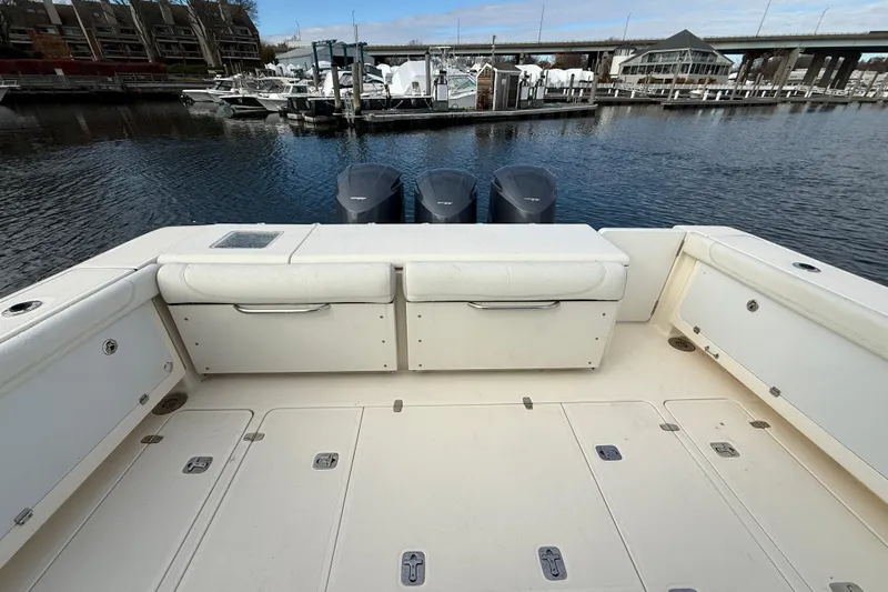  Yacht Photos Pics 2009 Pursuit OS 375 Offshore boat deck with twin outboard motors at marina.