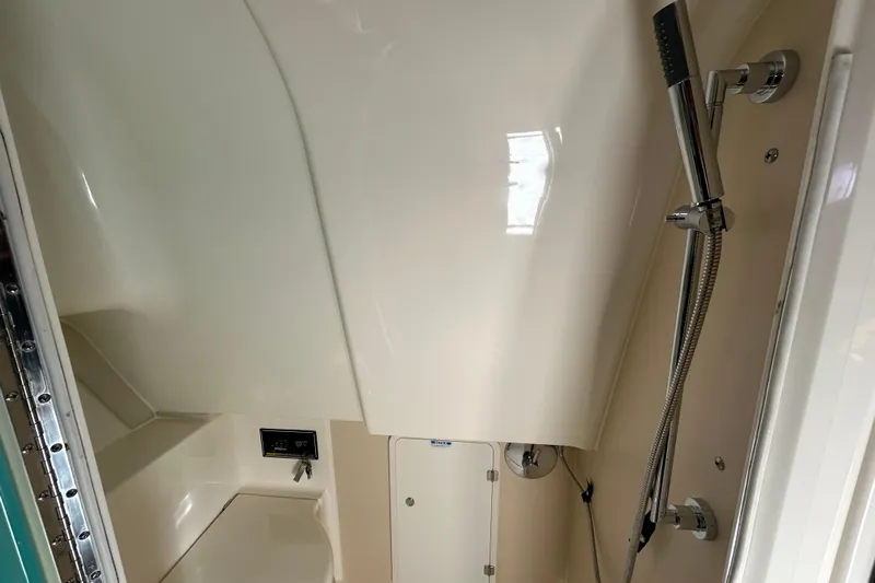  Yacht Photos Pics 2009 Pursuit OS 375 Offshore boat bathroom with shower and toilet.