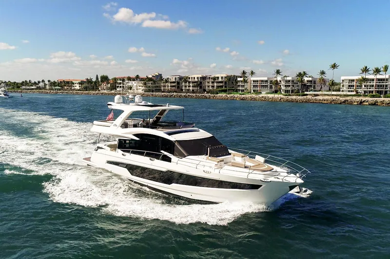 Aquasition Yacht Photos Pics Luxurious 2020 Galeon 680 Fly yacht cruising near coastal residences.
