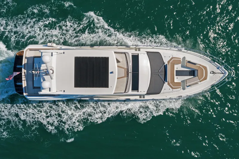 Aquasition Yacht Photos Pics Aerial view of 2020 Galeon 680 Fly yacht cruising on the ocean.