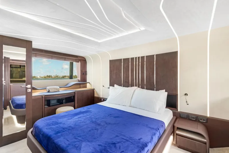 Aquasition Yacht Photos Pics Luxurious bedroom interior on 2020 Galeon 680 Fly yacht with modern design and blue bedding.