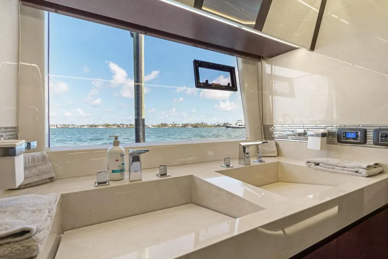 Aquasition Yacht Photos Pics Luxurious bathroom on 2020 Galeon 680 Fly yacht with ocean view and modern fixtures.