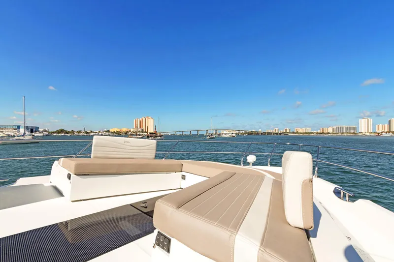 Aquasition Yacht Photos Pics Luxurious 2020 Galeon 680 Fly yacht with spacious deck, city skyline in background.