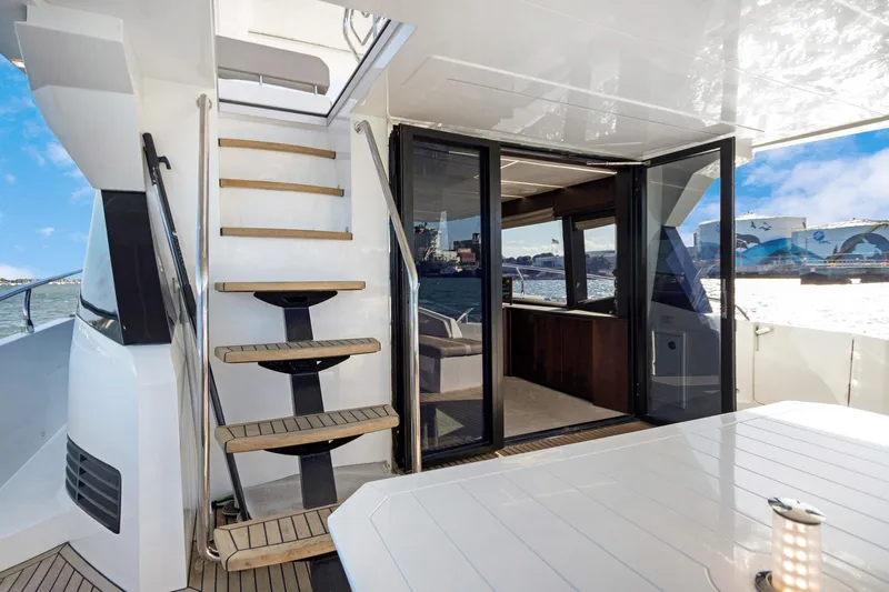 Aquasition Yacht Photos Pics Luxury yacht Galeon 680 Fly 2020, featuring elegant stairs and spacious deck area.