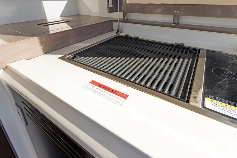 Aquasition Yacht Photos Pics Outdoor grill on 2020 Galeon 680 Fly yacht, featuring Kenyon electric cooktop.
