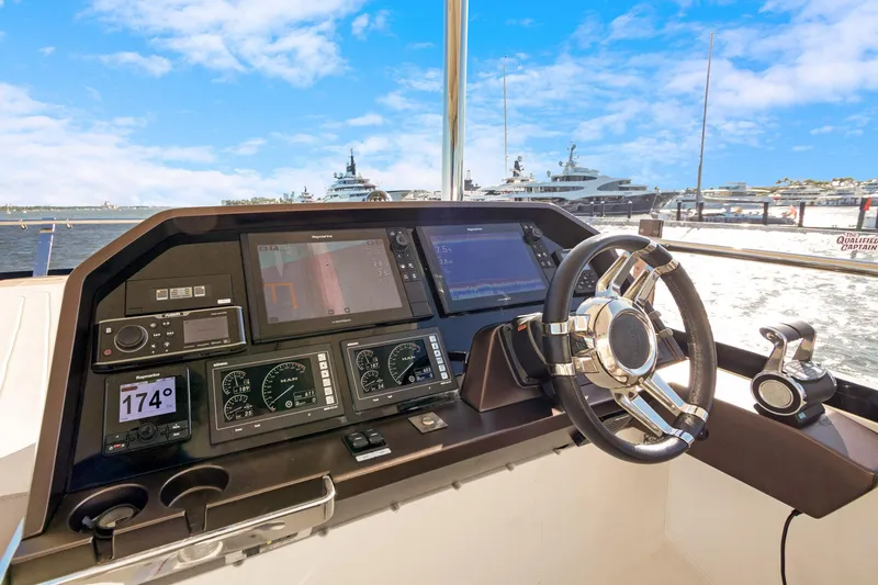 Aquasition Yacht Photos Pics Cockpit of 2020 Galeon 680 Fly yacht with advanced navigation systems and steering wheel.