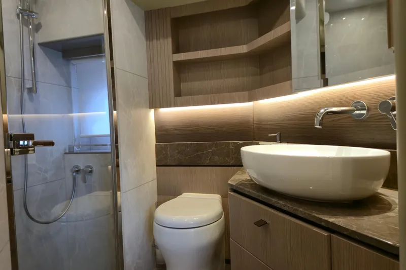  Yacht Photos Pics Luxurious bathroom in 2025 Absolute Navetta 53 yacht with modern fixtures and elegant design.