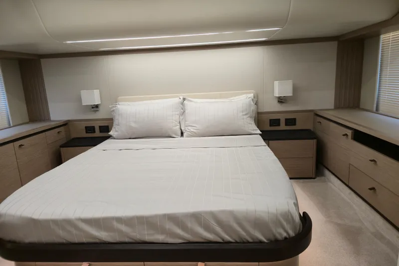  Yacht Photos Pics Luxurious bedroom interior of 2025 Absolute Navetta 53 yacht with modern design and elegant furnishings.