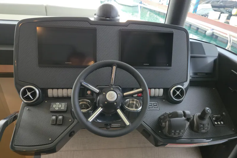  Yacht Photos Pics Cockpit of 2025 Absolute Navetta 53 yacht with dual screens and modern controls.