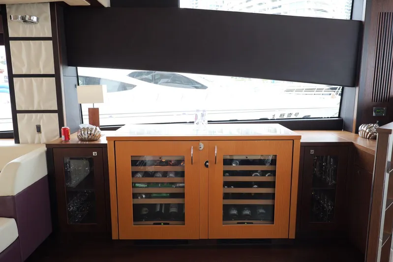  Yacht Photos Pics Luxurious interior of 2013 Sunseeker Manhattan 73 yacht with elegant cabinetry and window view.