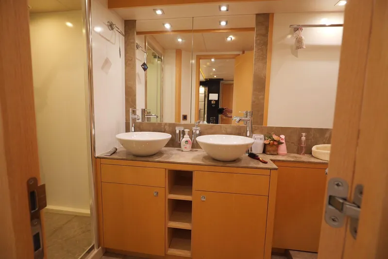  Yacht Photos Pics Luxurious bathroom in 2013 Sunseeker Manhattan 73 yacht with dual sinks and modern fixtures.