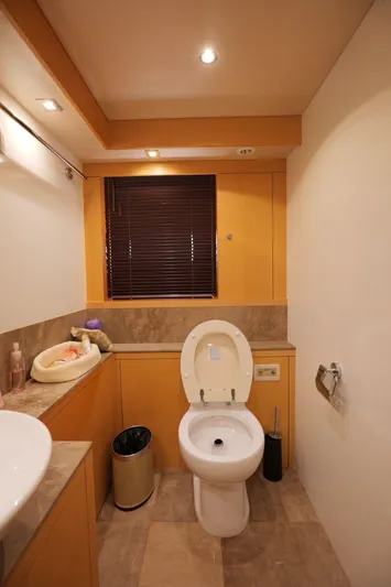  Yacht Photos Pics Luxurious bathroom in 2013 Sunseeker Manhattan 73 yacht, featuring modern fixtures and elegant design.