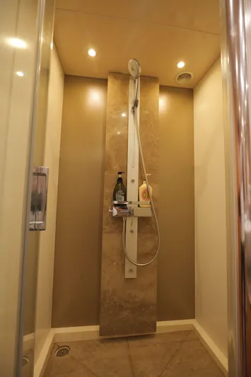  Yacht Photos Pics Luxurious shower in 2013 Sunseeker Manhattan 73 yacht with modern fixtures and elegant design.