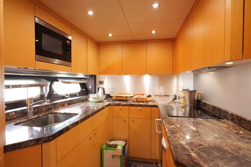  Yacht Photos Pics Luxurious kitchen interior of 2013 Sunseeker Manhattan 73 yacht with modern amenities.