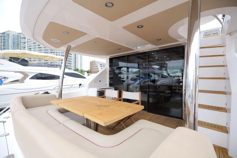  Yacht Photos Pics Luxurious Sunseeker Manhattan 73 yacht deck with seating and dining area, 2013 model.