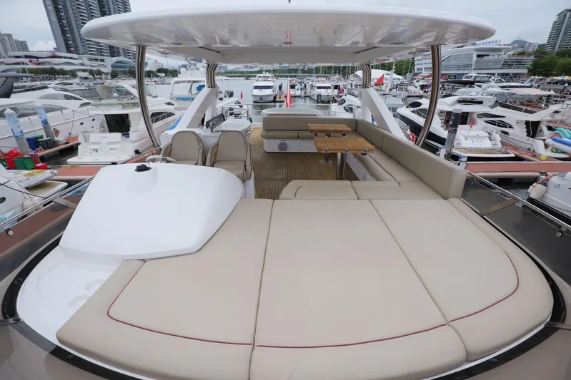  Yacht Photos Pics Luxurious Sunseeker Manhattan 73 yacht deck with seating, 2013 model, docked in marina.