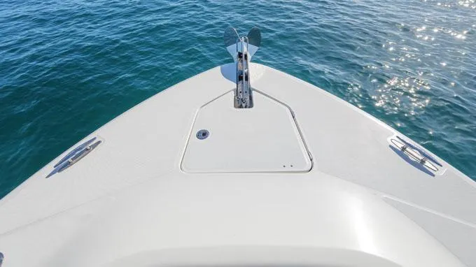 Reel Addiction Yacht Photos Pics Bow of 2016 HCB Suenos 53 boat on calm blue water.