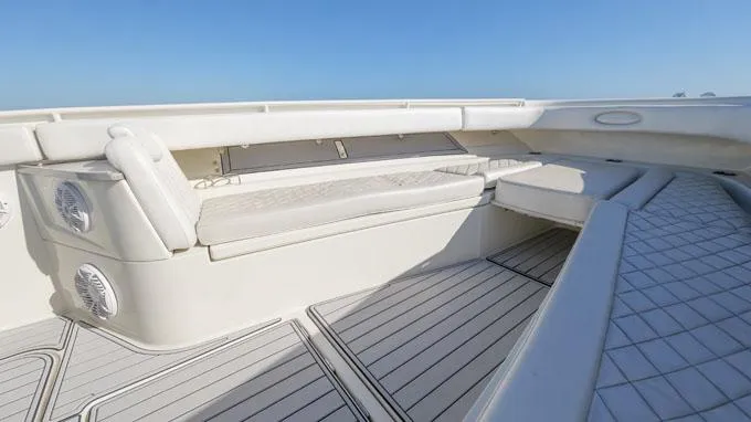 Reel Addiction Yacht Photos Pics 2016 HCB Suenos 53 boat interior with cushioned seating and sleek deck design.