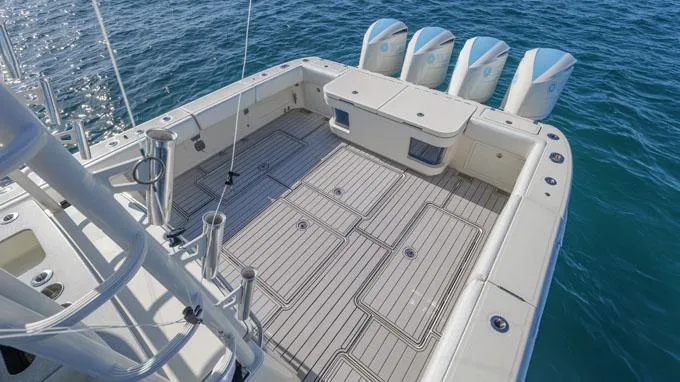Reel Addiction Yacht Photos Pics HCB Suenos 53 boat deck with four engines, 2016 model, on open water.