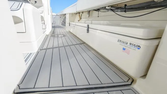 Reel Addiction Yacht Photos Pics HCB Suenos 53 boat deck, 2016 model, featuring sleek design and Frigid Rigid cooler.