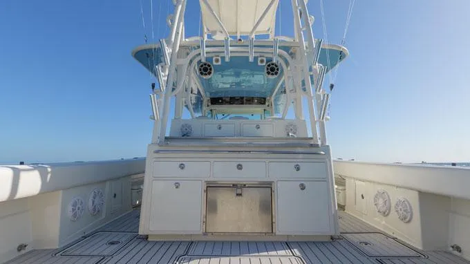 Reel Addiction Yacht Photos Pics 2016 HCB Suenos 53 boat deck with helm station and storage cabinets.