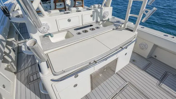 Reel Addiction Yacht Photos Pics HCB Suenos 53 boat deck with fishing amenities, 2016 model, on open water.