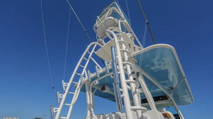 Reel Addiction Yacht Photos Pics HCB Suenos 53 boat tower against clear blue sky, 2016 model.