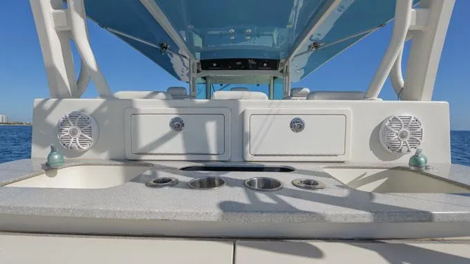 Reel Addiction Yacht Photos Pics HCB Suenos 53 boat interior, featuring storage compartments and cup holders, 2016 model.