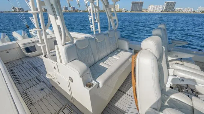 Reel Addiction Yacht Photos Pics Luxurious seating on 2016 HCB Suenos 53 yacht with ocean backdrop.
