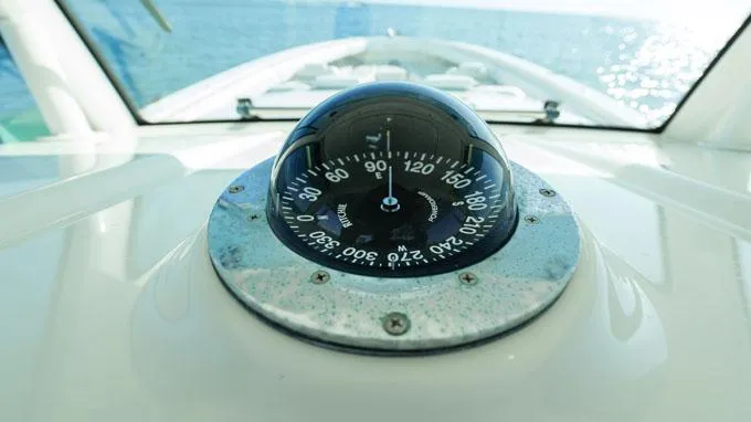 Reel Addiction Yacht Photos Pics Compass on HCB Suenos 53 boat, 2016 model, with ocean view in background.