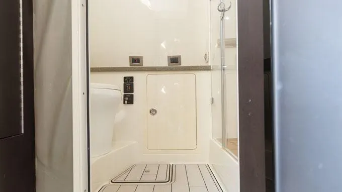 Reel Addiction Yacht Photos Pics Interior of 2016 HCB Suenos 53 yacht bathroom with modern fixtures and sleek design.