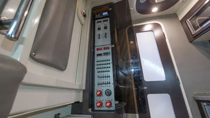 Reel Addiction Yacht Photos Pics Electrical control panel inside 2016 HCB Suenos 53 boat cabin, featuring switches and gauges.