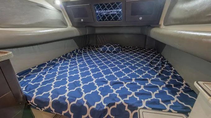 Reel Addiction Yacht Photos Pics Interior cabin of 2016 HCB Suenos 53 with patterned bedding.