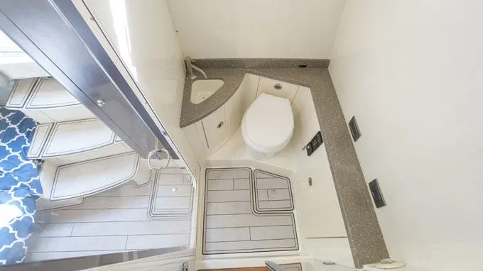 Reel Addiction Yacht Photos Pics Bathroom interior of 2016 HCB Suenos 53 boat, featuring modern fixtures and compact design.