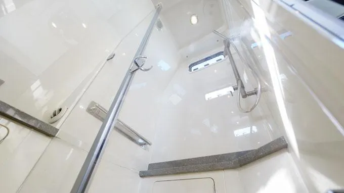 Reel Addiction Yacht Photos Pics Luxurious bathroom interior of 2016 HCB Suenos 53 yacht, featuring sleek design and modern fixtures.