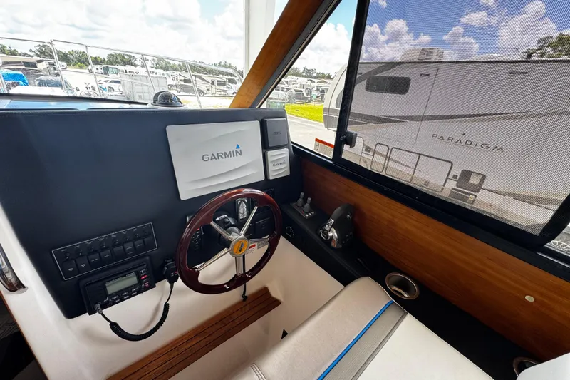 Happy Ours Yacht Photos Pics 2019 Cutwater C-28 boat helm with Garmin navigation system and steering wheel.
