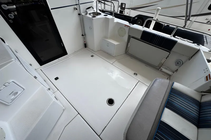 Happy Ours Yacht Photos Pics 2019 Cutwater C-28 boat interior with seating and sink area.
