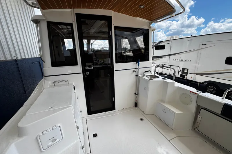 Happy Ours Yacht Photos Pics 2019 Cutwater C-28 boat deck with sleek design and modern amenities.