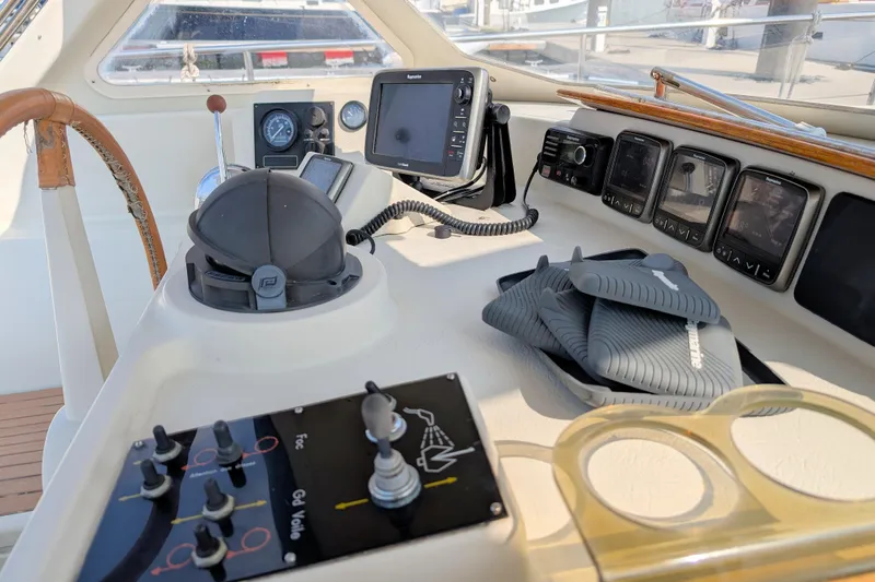 Iteration Yacht Photos Pics Cockpit of 1994 Amel 53 Super Maramu yacht with navigation instruments and controls.