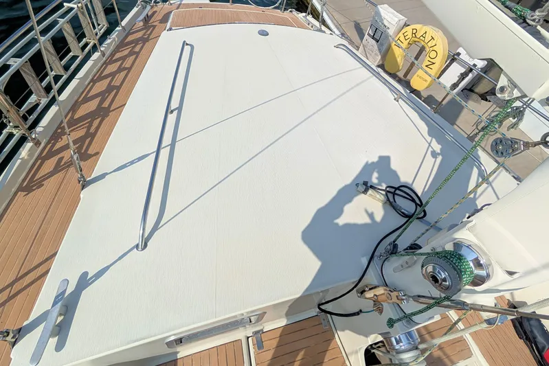 Iteration Yacht Photos Pics Deck of 1994 Amel 53 Super Maramu sailboat with winch and railing.