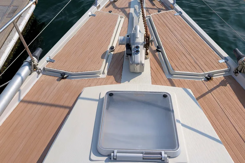 Iteration Yacht Photos Pics Deck of 1994 Amel 53 Super Maramu sailboat with wooden finish and hatch.