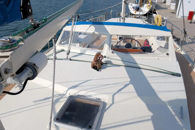 Iteration Yacht Photos Pics Sailboat deck of 1994 Amel 53 Super Maramu with plush toy and steering wheel.