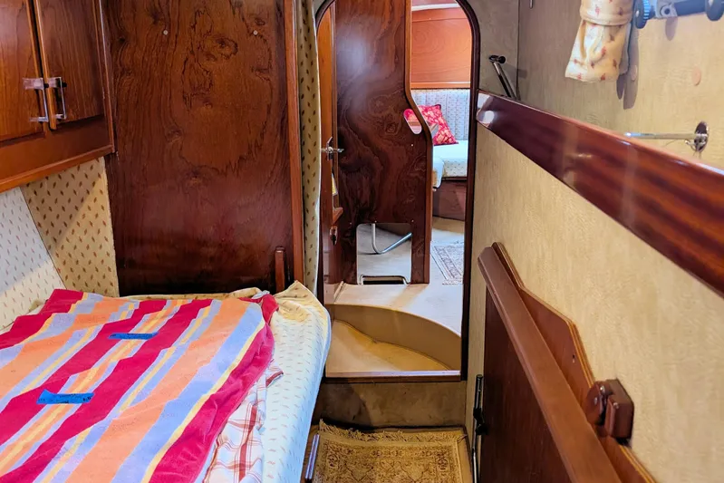 Iteration Yacht Photos Pics Interior of 1994 Amel 53 Super Maramu yacht, featuring cozy cabin and wooden finishes.