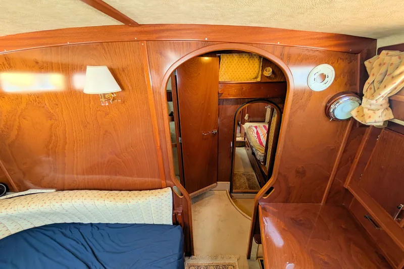 Iteration Yacht Photos Pics Interior of 1994 Amel 53 Super Maramu yacht with wood paneling and cozy cabin layout.