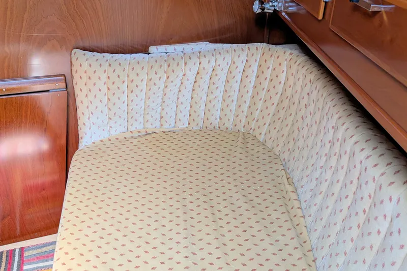 Iteration Yacht Photos Pics Cozy cabin interior of 1994 Amel 53 Super Maramu yacht with patterned upholstery.
