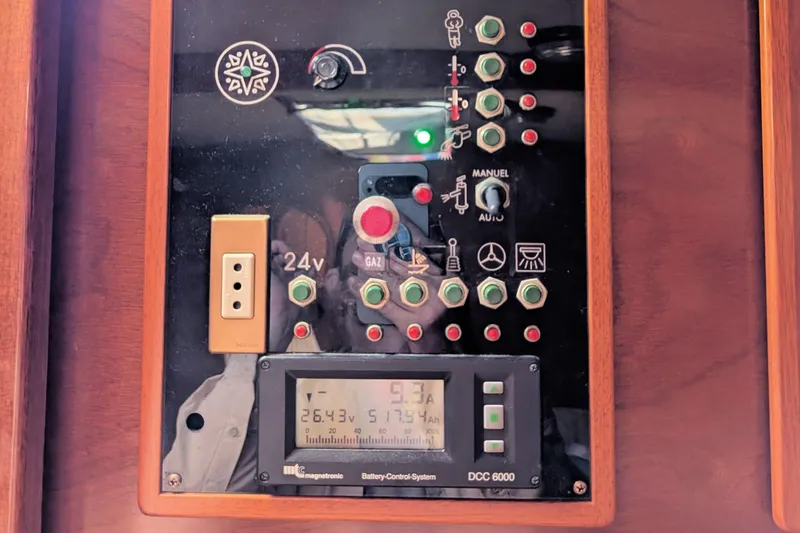 Iteration Yacht Photos Pics Control panel of a 1994 Amel 53 Super Maramu sailboat with various switches and indicators.